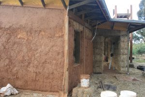 Three coats of successively finer clay were used to render the straw bale house. 